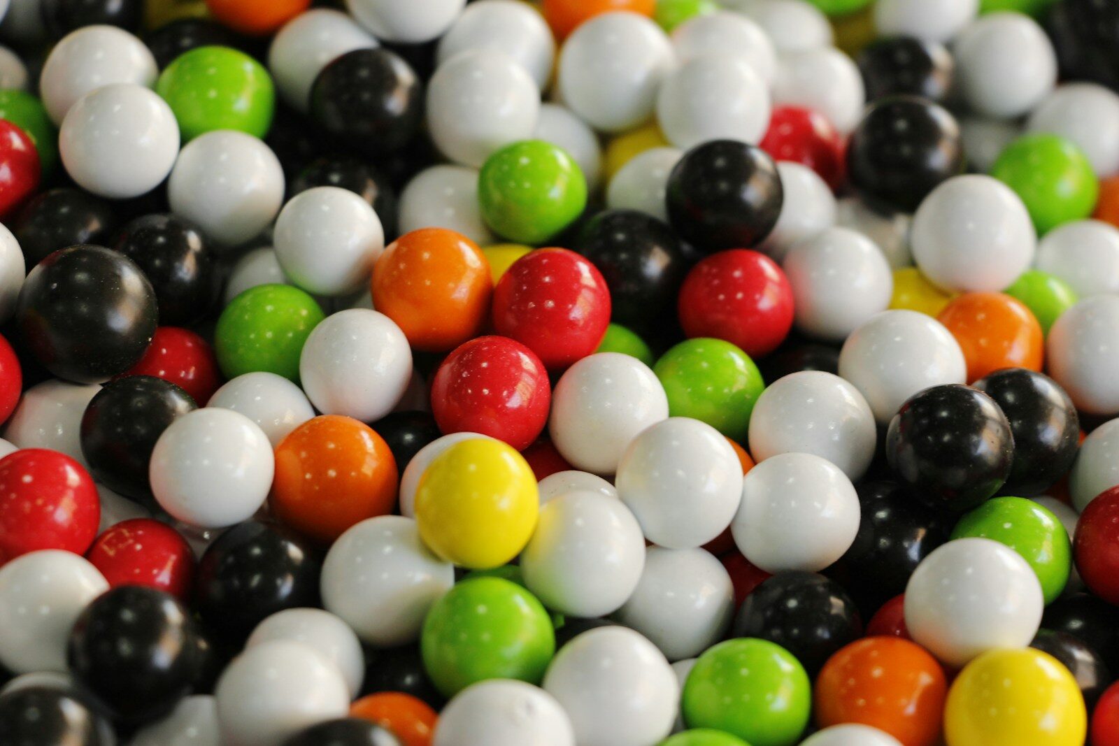 A colorful pile of round candies.